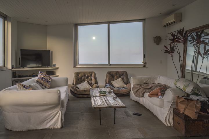 Living room of a flat shot against the light, untreated.