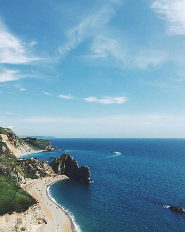 Mediterranean coast seen from the air, with a cove and a beach.
